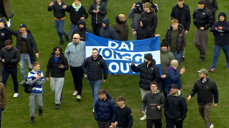 Reading pitch invasion in protest over owner.