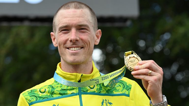 FILE - Gold medal winner Rohan Dennis of Australia poses with his medal after the men&#39;s cycling individual time trials at the Commonwealth Games in West Park, Wolverhampton, England, on Aug. 4, 2022. Dennis was reported to have been charged in connection with the death of his wife, Olympic cyclist Melissa Hoskins, who died after being struck by a vehicle while riding in Adelaide. (AP Photo/Rui Vieira, File)