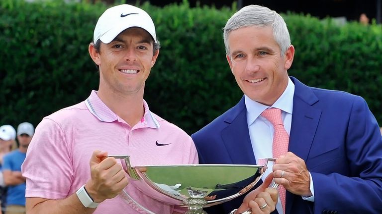Rory McIlroy and Jay Monahan (Associated Press)