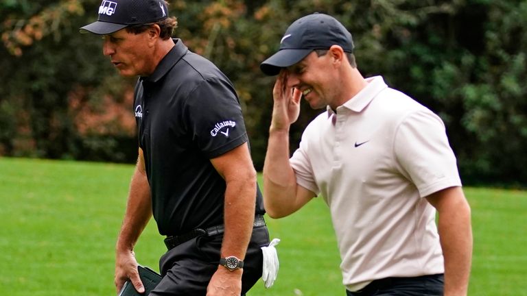 Phil Mickelson and Rory McIlroy in conversation during a practice round at Augusta in 2020