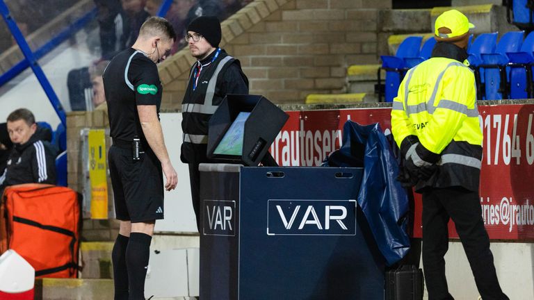 PERTH, SCOTLAND - JANUARY 24: Referee John Beaton consults the VAR monitor before awarding Aberdeen a penalty during a cinch Premiership match between St Johnstone and Aberdeen at McDiarmid Park, on January 24, 2024, in Perth, Scotland. (Photo by Ross Parker / SNS Group)