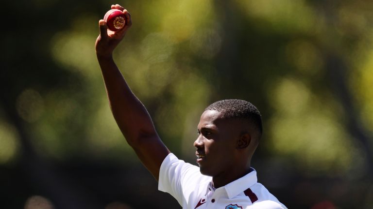 West Indies' Shamar Joseph holds up the ball after taking 5 wickets against Australia on day two of the opening Test in Adelaide