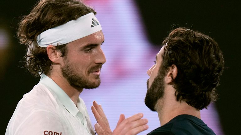 Stefanos Tsitsipas, left, of Greece is congratulated by Jordan Thompson of Australia following their second round match at the Australian Open tennis championships at Melbourne Park, Melbourne, Australia, Wednesday, Jan. 17, 2024. (AP Photo/Andy Wong)