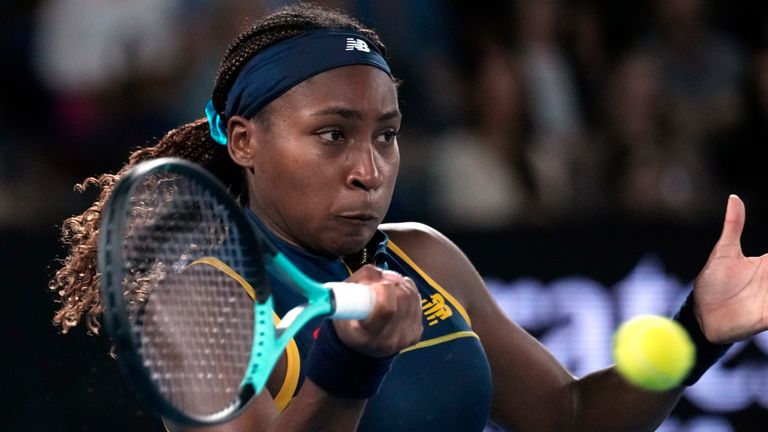 Coco Gauff of the U.S. plays a forehand return to Aryna Sabalenka of Belarus during their semifinal match at the Australian Open tennis championships at Melbourne Park, Melbourne, Australia, Thursday, Jan. 25, 2024. (AP Photo/Alessandra Tarantino)