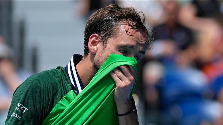 Daniil Medvedev of Russia wipes the sweat from his face during his quarterfinal match against Hubert Hurkacz of Poland at the Australian Open tennis championships at Melbourne Park, Melbourne, Australia, Wednesday, Jan. 24, 2024. (AP Photo/Andy Wong)