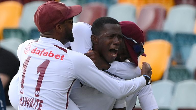 Shamar Joseph celebrates with team-mates after bowling West Indies to victory in the second Test against Australia