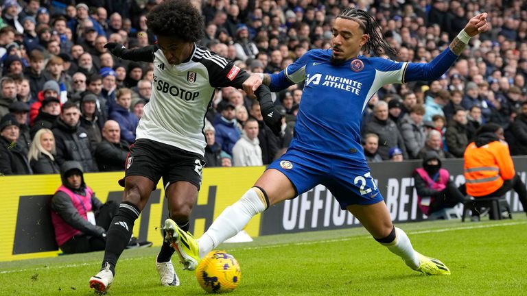 Chelsea's Malo Gusto, right, challenges for the ball with Fulham's Willian during the English Premier League soccer match between Chelsea and Fulham at Stamford Bridge stadium in London, Saturday, Jan. 13, 2024. (AP Photo/Frank Augstein)