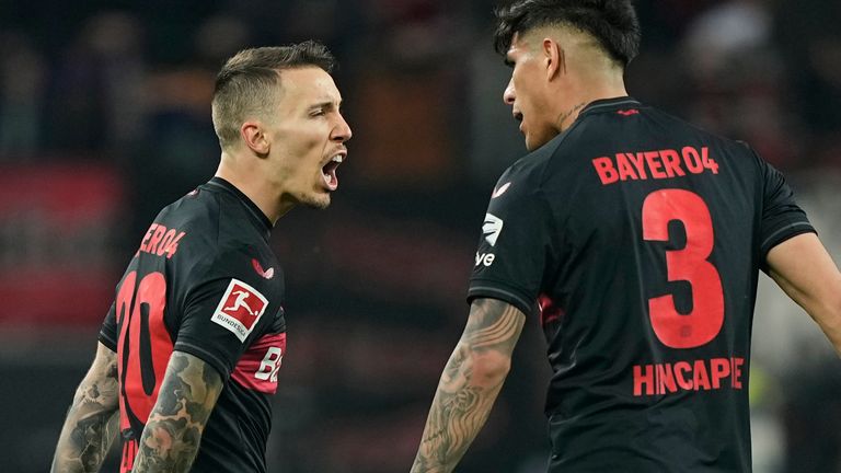 Leverkusen's Alex Grimaldo celebrates with team-mate Piero Hincapie after scoring his side's second goal