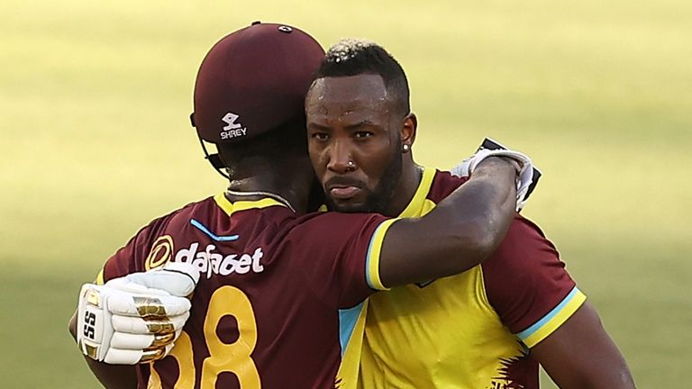 West Indies' Andre Russell hugs team-mate Sherfane Rutherford (Getty Images)