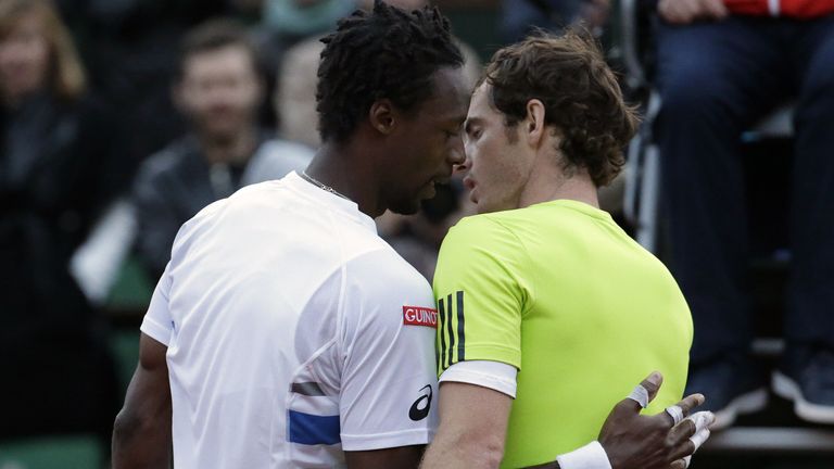 Great Britain's Andy Murray (R) is congratulated by France's Gael Monfils at the end of their French tennis Open quarter final match at the Roland Garros stadium in Paris on June 4, 2014. AFP PHOTO / KENZO TRIBOUILLARD (Photo credit should read KENZO TRIBOUILLARD/AFP via Getty Images)