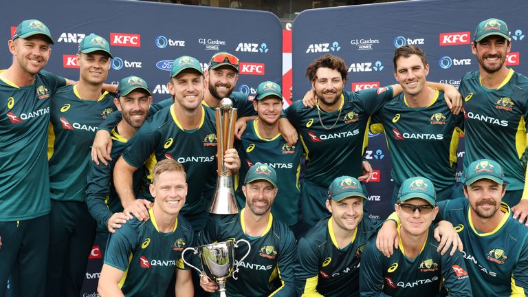 Australia players pose as they celebrate winning the series 3-0 after the third Twenty20 international cricket match between New Zealand and Australia at Eden Park in Auckland on February 25, 2024. (Photo by MICHAEL BRADLEY / AFP)