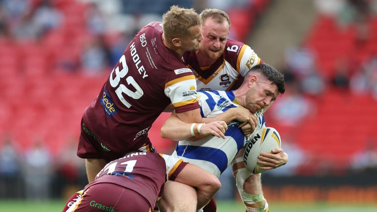 Batley Bulldogs v Halifax Panthers - AB Sundecks 1895 Cup - Final - Wembley
Batley Bulldogs� Dane Manning (left) Luke Hooley (second left) and Josh Woods tackle Halifax Panthers� Zack McComb during the AB Sundecks 1895 Cup final at Wembley, London. Picture date: Saturday August 12, 2023.