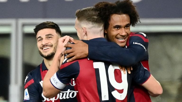 Bologna's Lewis Ferguson, center with back to camera, celebrates with teammates after scoring his side's opening goal during a Serie A soccer match between Bologna and Atalanta, in Bologna's Renato Dall'Ara stadium, Italy, Saturday, Dec. 23, 2023. (Massimo Paolone/LaPresse via AP)