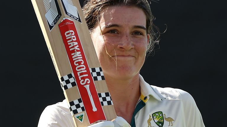 Annabel Sutherland raises her bat after being dismissed for 210 in Australia's Test against South Africa