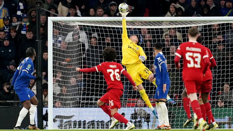 Chelsea goalkeeper Djordje Petrovic tips over a header from Liverpool's Jayden Danns