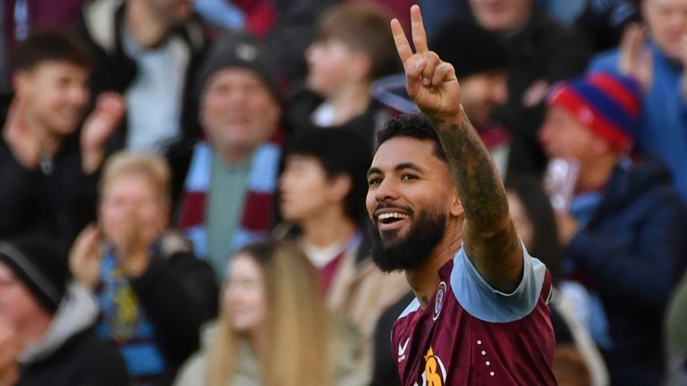 Aston Villa's Douglas Luiz celebrates after scoring their third goal