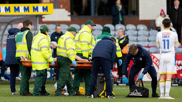 DUNDEE, SCOTLAND - FEBRUARY 11: Dundee's Michael Mellon is forced off with a head injury during a cinch Premiership match between Dundee and St Johnstone at the Scot Foam Stadium at Dens Park, on February 11, 2024, in Dundee, Scotland. (Photo by Ross Parker / SNS Group)