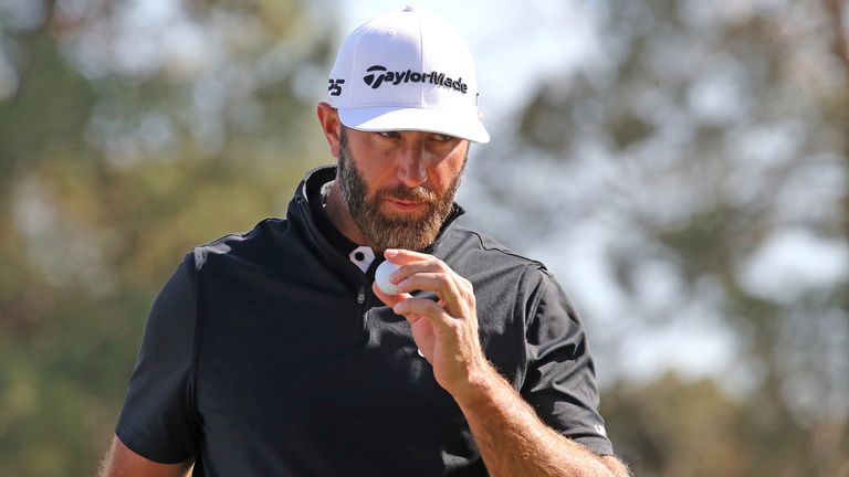 LAS VEGAS, NV - FEBRUARY 09: Dustin Johnson of 4Aces GC blows on his ball after marking it during the LIV Golf League tournament on February 09, 2024 at the Las Vegas Country Club in Las Vegas, NV. (Photo by Matthew Bolt/Icon Sportswire) (Icon Sportswire via AP Images)