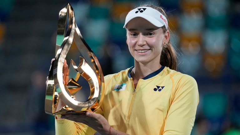 Elena Rybakina of Kazakhstan holds the trophy after she beats Daria Kasatkina in the final match of the Mubadala Abu Dhabi Open tennis tournament, in Abu Dhabi, United Arab Emirates, Sunday, Feb. 11, 2024. (AP Photo/Kamran Jebreili)