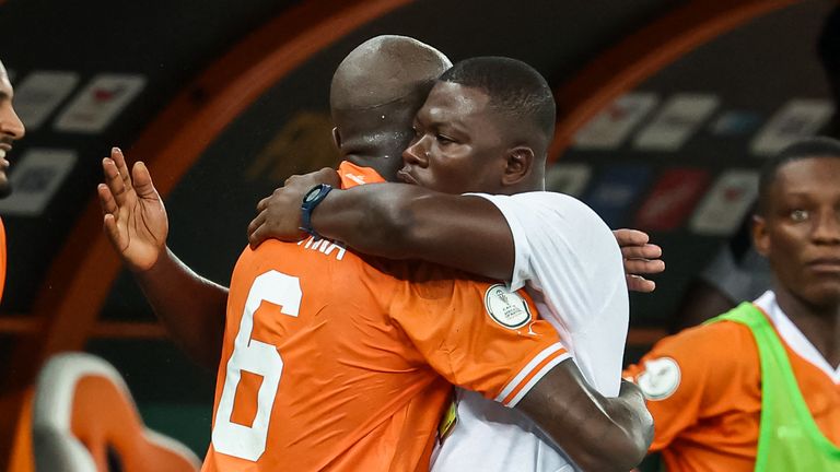 Emerse Fae (right) had never managed a senior game before taking charge of the Ivory Coast's last-16 game with Senegal