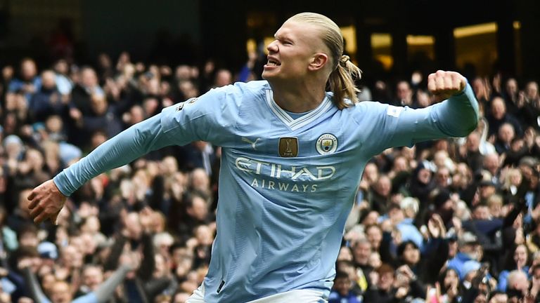 Manchester City's Erling Haaland celebrates with after scoring his side's second goal