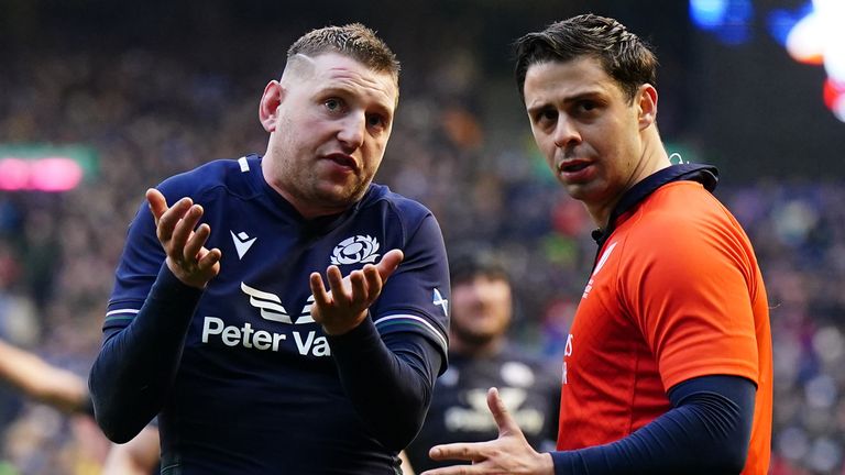 Scotland's Finn Russell speaks to referee Nika Amashukeli as they wait for the dramatic late TMO decision 