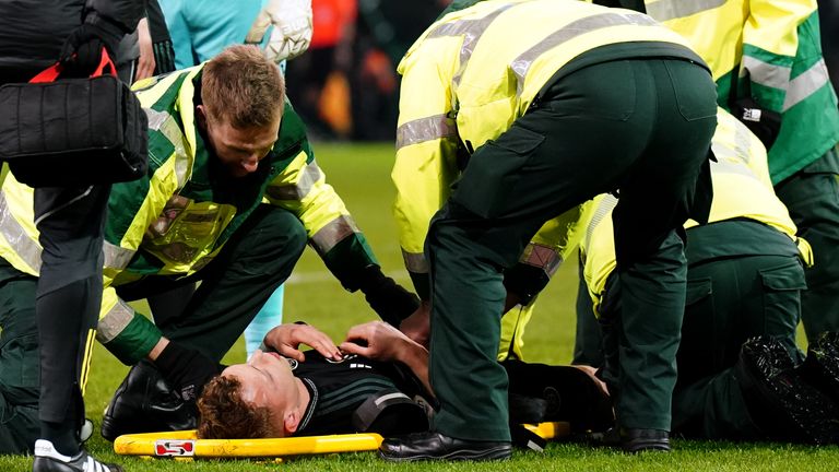 Celtic's Alistair Johnston is placed onto a stretcher