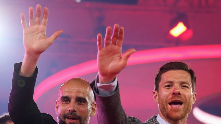 MUNICH, GERMANY - MAY 14: Head Coach, Pep Guardiola (L) and Xabi Alonso wave on stage during the FC Bayern Muenchen Bundesliga Champions Dinner at the Postpalast on May 14, 2016 in Munich, Bavaria. Photo by: Lars Baron/picture-alliance/dpa/AP Images