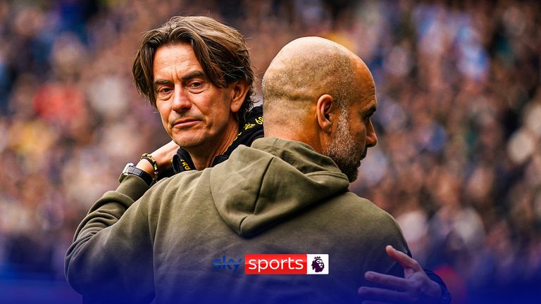 Manchester City's head coach Pep Guardiola, right, hugs with Brentford's head coach Thomas Frank