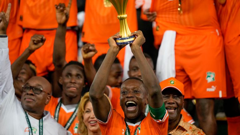 Ivory Coast's Max-Alain Gradel lifts the trophy