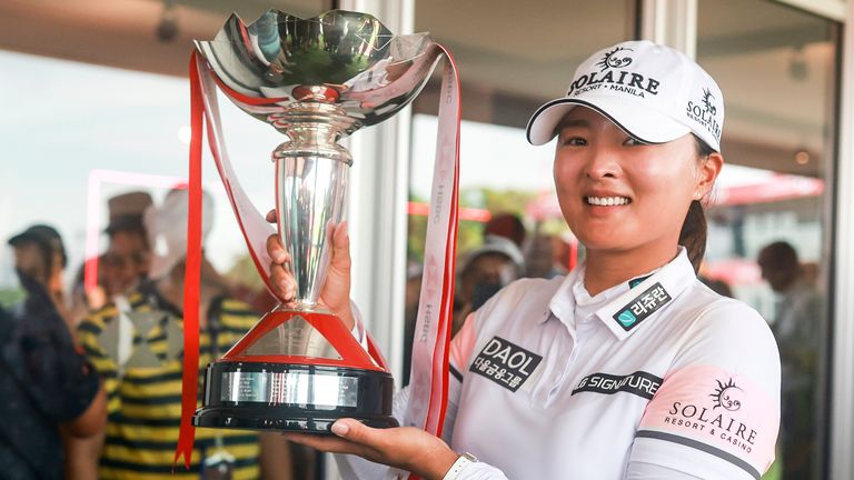 Jin Young Ko of South Korea poses with the trophy after winning the HSBC Women's World Championship at the Sentosa Golf course, in Singapore, Sunday, March 5, 2023. (AP Photo/Danial Hakim)