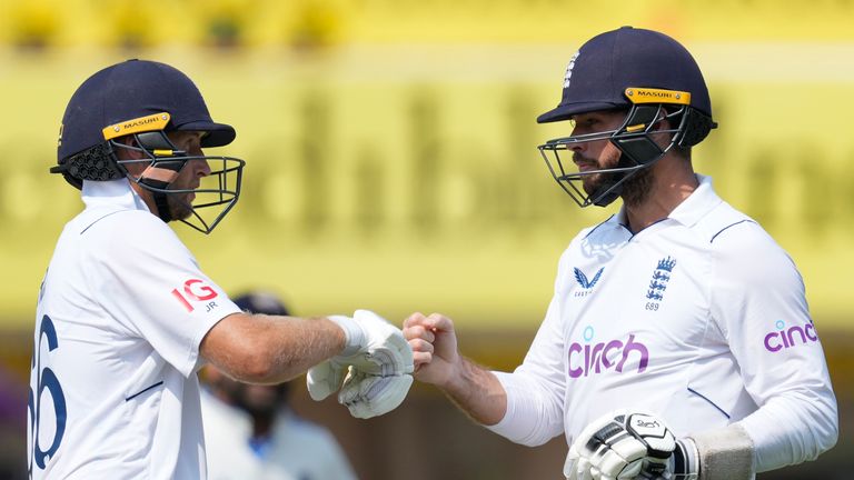 England's Joe Root, left and Ben Foakes greet each other on the first day of the fourth cricket test match between England and India in Ranchi, India, Friday, Feb. 23, 2024. (AP Photo/Ajit Solanki)