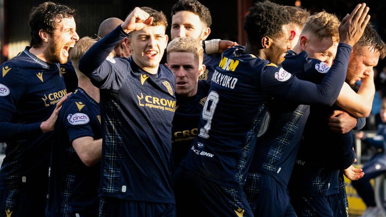 DUNDEE, SCOTLAND - FEBRUARY 11: Dundee's Jordan McGhee celebrates scoring to make it 2-1 with his teammates during a cinch Premiership match between Dundee and St Johnstone at the Scot Foam Stadium at Dens Park, on February 11, 2024, in Dundee, Scotland. (Photo by Ross Parker / SNS Group)