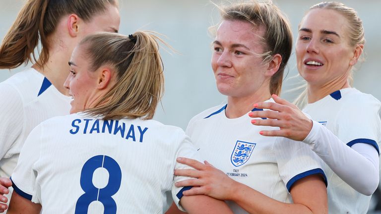 Lauren Hemp is congratulated by her England teammates after scoring two first-half goals against Italy