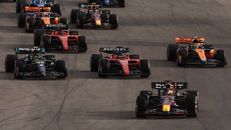 CIRCUIT OF THE AMERICAS, UNITED STATES OF AMERICA - OCTOBER 21: Max Verstappen, Red Bull Racing RB19, leads Charles Leclerc, Ferrari SF-23, Sir Lewis Hamilton, Mercedes F1 W14, Lando Norris, McLaren MCL60, and the rest of the field at the start during the United States GP at Circuit of the Americas on Saturday October 21, 2023 in Austin, United States of America. (Photo by Zak Mauger / LAT Images)