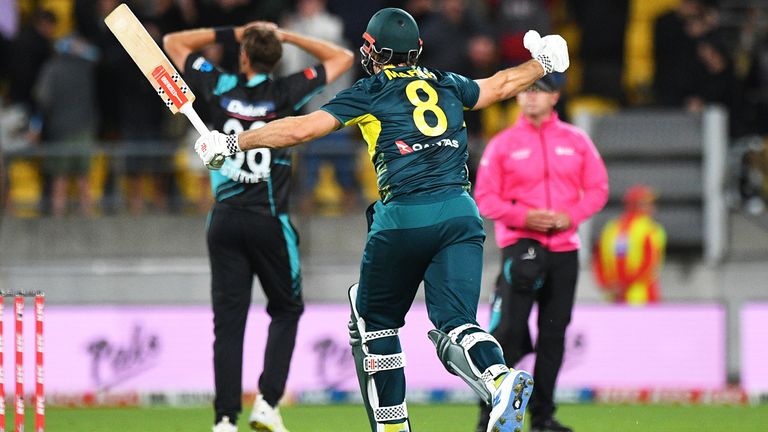 Australia's Mitchell Marsh celebrates after beating New Zealand by six wickets