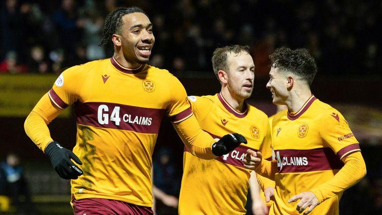 Motherwell's Theo Bair (left) celebrates scoring a penalty to make it 3-0