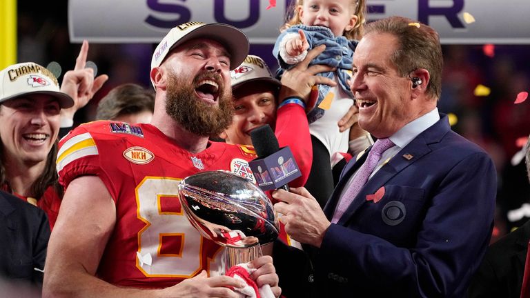 Travis Kelce celebrates with the Vince Lombardi trophy