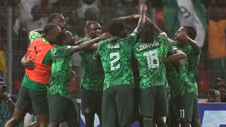 Nigeria's players celebrate after William Troost-Ekong scores from the penalty spot