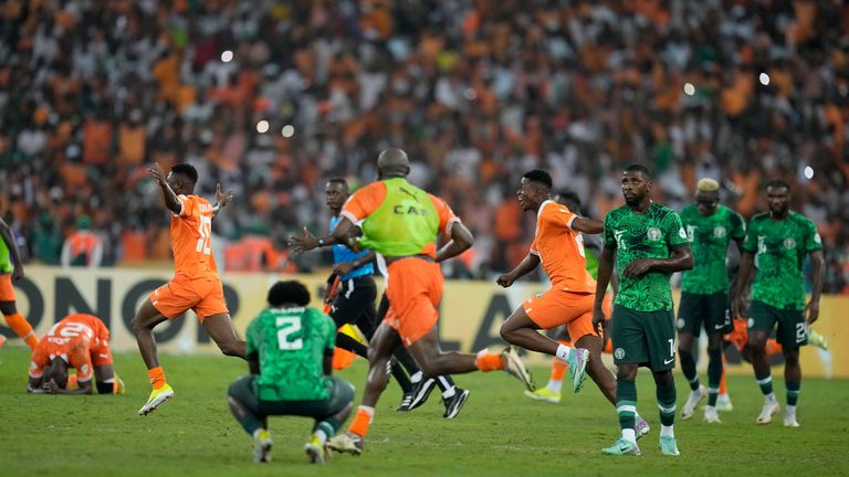 Ivory Coast players celebrate at the final whistle