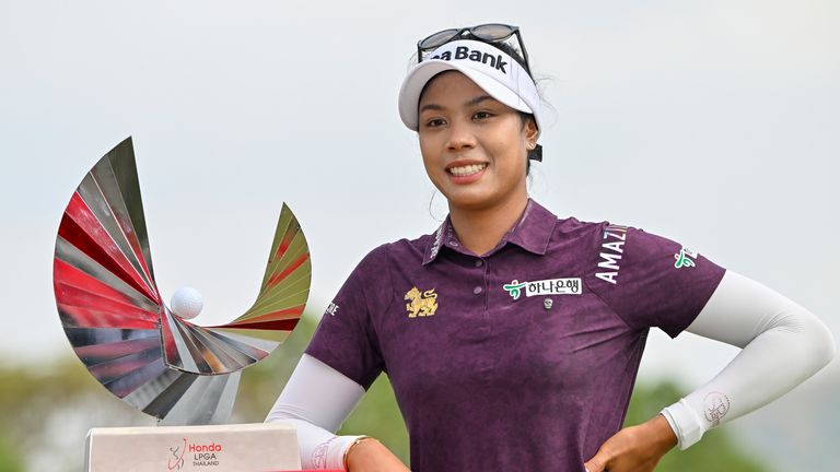 Patty Tavatanakit of Thailand poses for a photo with her trophy during the award ceremony after winning the LPGA Honda Thailand golf tournament in Pattaya, southern Thailand, Sunday, Feb. 25, 2024. (AP Photo/Kittinun Rodsupan)