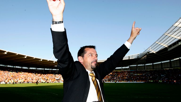 Hull's manager Phil Brown celebrates survival in the Premier League after his team's English Premier League soccer match against Manchester United at The KC Stadium, Hull, England, Sunday May 24, 2009.