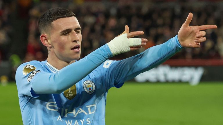 Manchester City's Phil Foden celebrates after scoring his side's second goal vs  Brentford