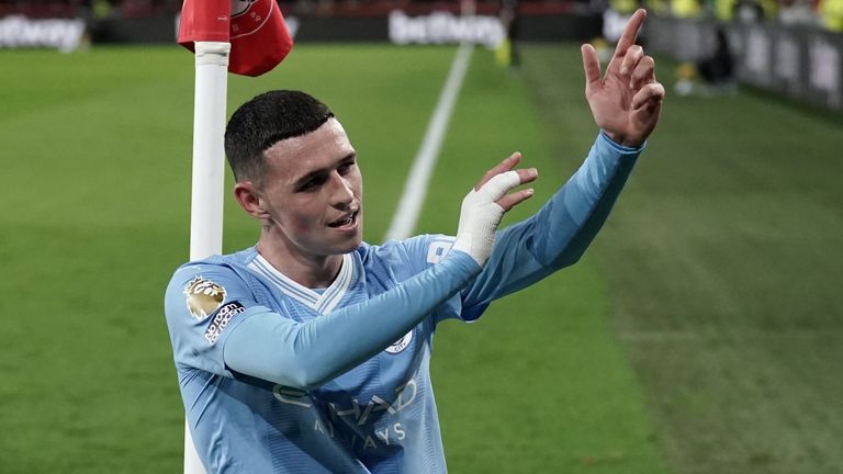 Phil Foden celebrates completing his hat-trick for Man City against Brentford