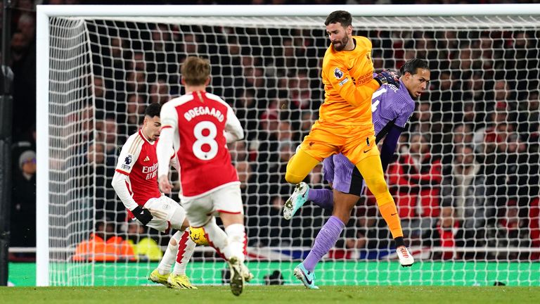 Gabriel Martinelli scores for Arsenal after a defensive mix-up between Alisson and Virgil van Dijk