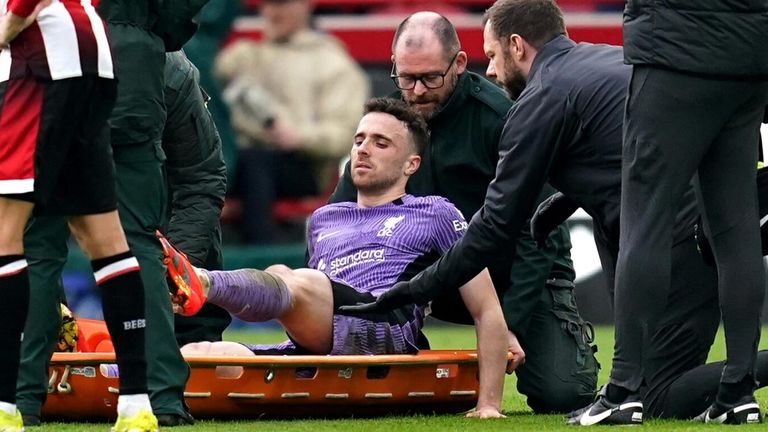 Diogo Jota is helped onto a stretcher after suffering an injury in Liverpool's clash with Brentford