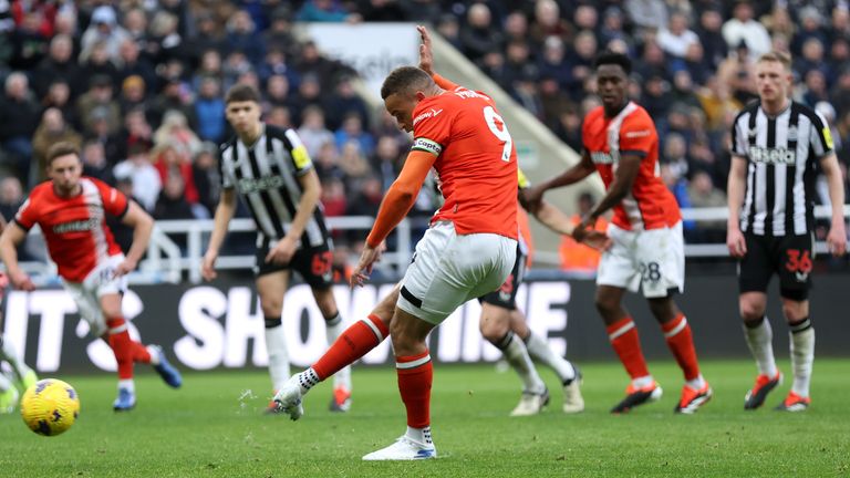 Carlton Morris scores from the penalty spot to give Luton a 3-2 lead at Newcastle