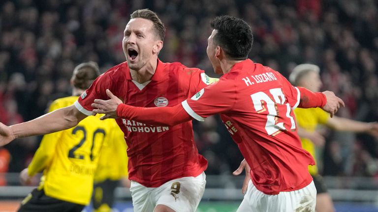 PSV's Luuk de Jong, left, celebrates after scoring his controversial penalty