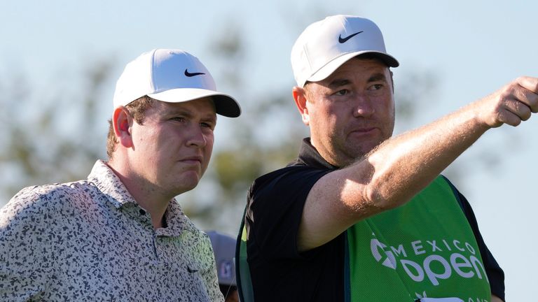 Robert MacIntyre, of Scotland, left, listens to his caddie at the first tee during the first round of the Mexico Open golf tournament in Puerto Vallarta, Mexico, Thursday, Feb. 22, 2024. (AP Photo/Fernando Llano)