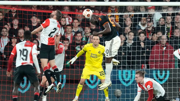 Roma's Romelu Lukaku, center right, heads the ball for goal during the Europa League play off, first leg soccer match between Feyenoord and Roma at De Kuip stadium in Rotterdam, Netherlands, Thursday, Feb. 15, 2024. (AP Photo/Peter Dejong)